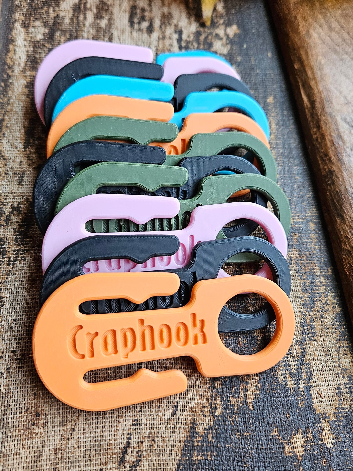 A double sided dog poop bag holder hook for responsible dog parents.